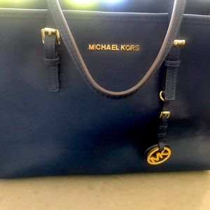 Michael Kors navy blue five pocket purse with gold accents